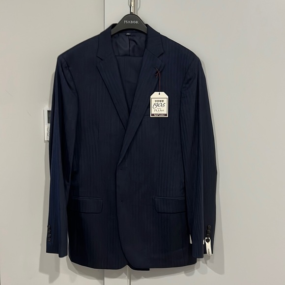 Navy Herringbone suit. Jacket - 43L Pants - 37 brand new/not tailored